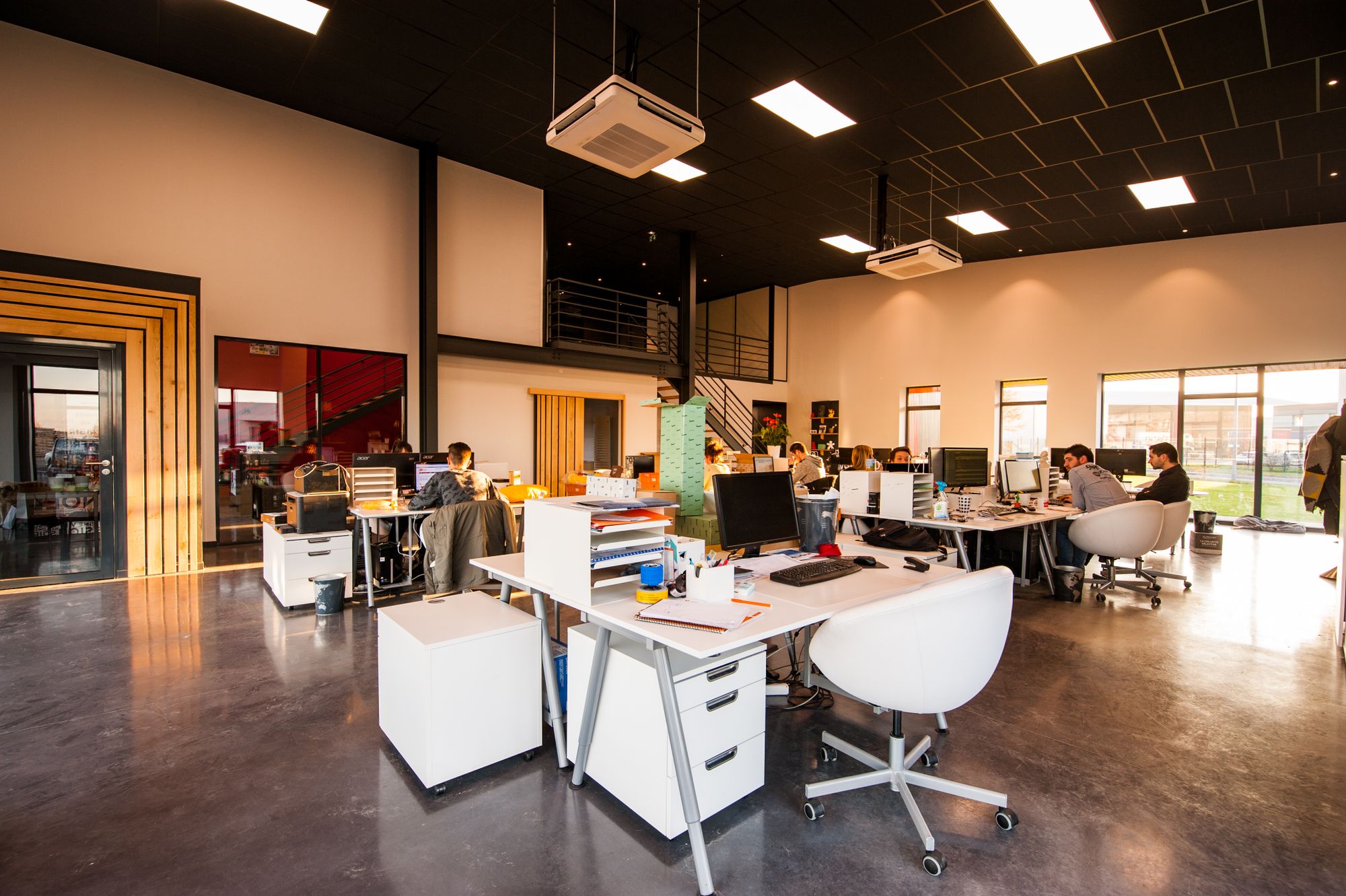 An open studio floor of desks, used as atmosphere for this kind of work